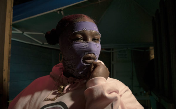 Leikeli47 poses for a photo after one of the masked rapper's performances at SXSW this year. Photos by Joshua Barajas/PBS NewsHour