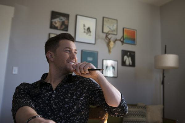 The former "American Idol" winner has a string of country hits, but was dropped by his label in 2016, a low point for the young country music star. But, from there, "I just kept taking one step at a time," he told the NewsHour. He released a new album last year. Photo by Jeff Ray