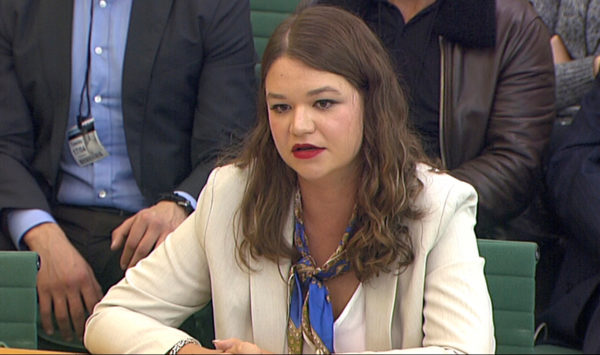 Brittany Kaiser, former Director of Program Development at Cambridge Analytica, speaks to Parliament's Digital, Culture Media and Sports committee in Westminster, London, Britain April 17, 2018. Parliament TV via Reuters