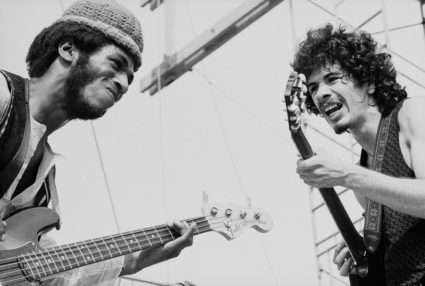 Mexican-born American musician Carlos Santana (right) and American bassist David Brown perform with the other members of Santana at 'Woodstock,' a large rock and roll music concert, Bethel, New York, August 16, 1969. (Photo by Tucker Ransom/Getty Images)