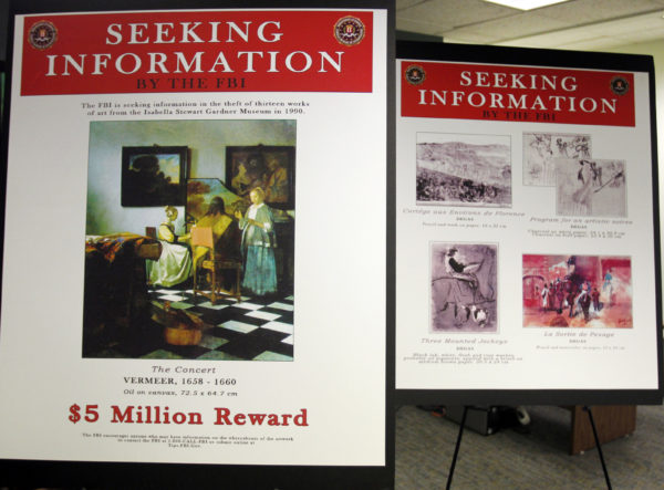FBI posters displaying works by artists Johannes Vermeer and Edgar Degas are seen during a 2013 press conference held to appeal to the public for help in returning artwork stolen in 1990 from the Isabella Stewart Gardner Museum. Photo by Jessica Rinaldi/Reuters