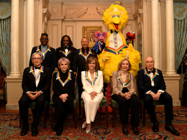 2019 Kennedy Center Honorees gather for a group photo (seated, L-R) conductor Michael Tilson Thomas, singer Linda Ronstadt, actress Sally Field, Sesame Street co-founders Joan Ganz Cooney and Dr. Lloyd Morrisette, (standing, L-R) Earth,Wind & Fire band members Philip Bailey, Verdine White and Ralph Johnson and Sesame Street characters Abby, Big Bird and Elmo, after a gala dinner at the U.S. State Department, in Washington, U.S., December 7, 2019. REUTERS/Mike Theiler