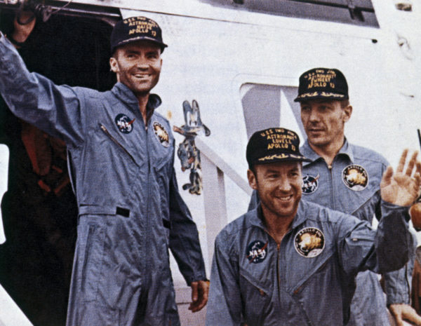 Apollo 13 astronauts James Lovell, John Swigert and Fred Haise returned safely to Earth after a forced trans-lunar flight. The astronauts are shown soon after their rescue still unshaven and wearing space overalls. Photo by SSPL/Getty Images