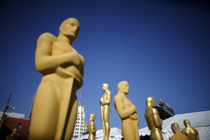 Oscar statues are painted outside the entrance to the Dolby Theatre as preparations continue for the 88th Academy Awards in Hollywood, Los Angeles, California February 25, 2016. The Oscars will be presented February 28, 2016. Photo by Lucy Nicholson/Reuters.