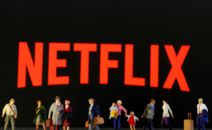 FILE PHOTO: Small toy figures are seen in front of diplayed Netflix logo in this illustration taken March 19, 2020. Photo by Reuters/Dado Ruvic/Illustration/File Photo