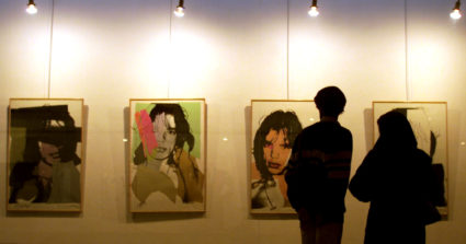 Iranians at Andy Warhol's portraits of Mick Jagger in Tehran's Museum of modern art February 12. [Ir..