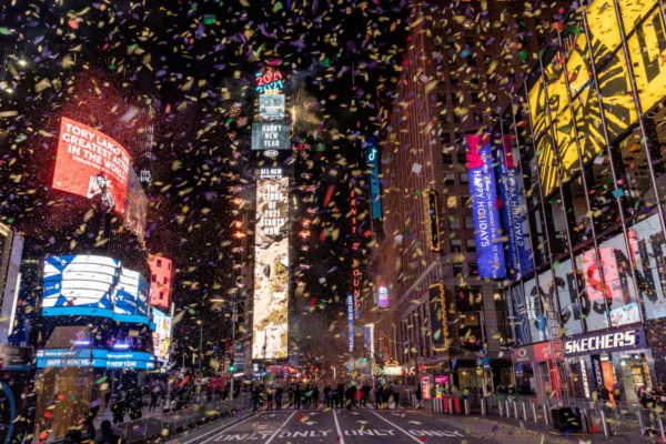 FILE PHOTO: Confetti flies around the ball and countdown clock in Times Square during the virtual New Year's Eve event fol...