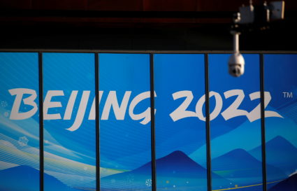 A surveillance camera is seen in front of a sign of Beijing 2022, a year ahead of the opening of the Games, at the Beijing Organising Committee for the 2022 Olympic and Paralympic Winter Games, in Beijing, China February 4, 2021. Photo by Tingshu Wang/REUTERS