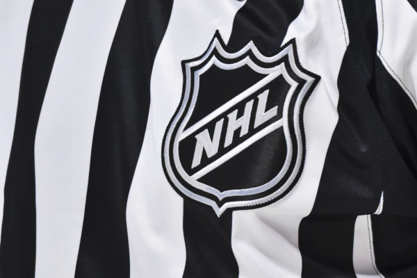 The NHL crest is seen on a referees uniform during the first period between the Montreal Canadiens and the Detroit Red Wings at Centre Bell on October 23, 2021 in Montreal, Canada. Photo by Minas Panagiotakis/Getty Images