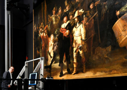 A restorer prepares Rembrandt's famous painting the 'Night Watch' after a first phase of study in Amsterdam
