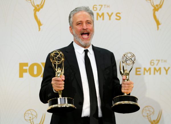 FILE PHOTO: Jon Stewart holds his awards during the 67th Primetime Emmy Awards in Los Angeles