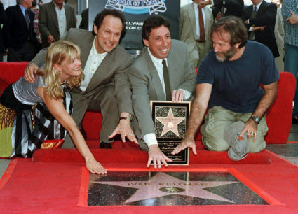 Film director Ivan Reitman poses with his plaque after his star on the Hollywood Walk of Fame was un..