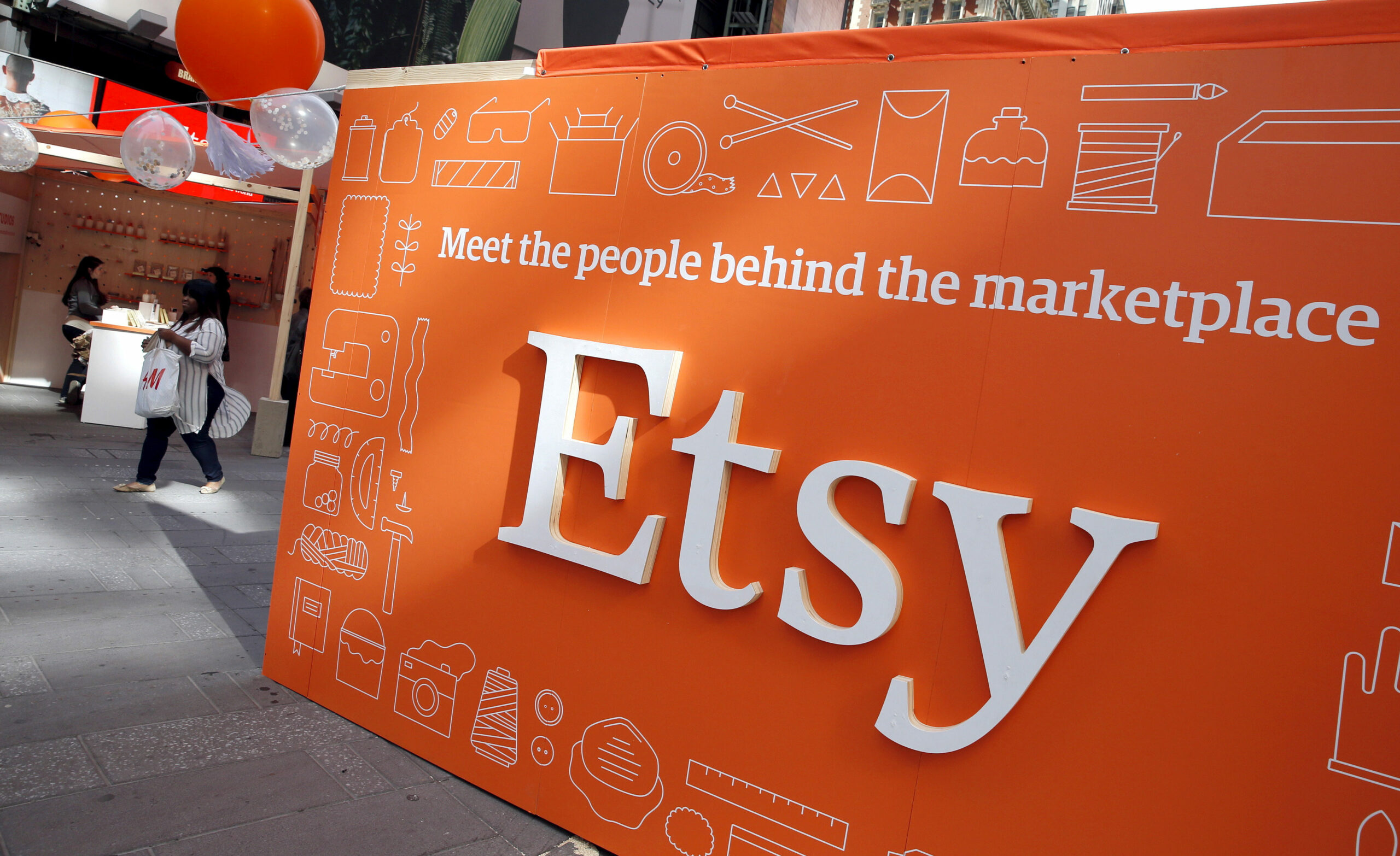 A sign advertising the online seller Etsy Inc. is seen outside the Nasdaq market site in Times Square following Etsy's IPO...