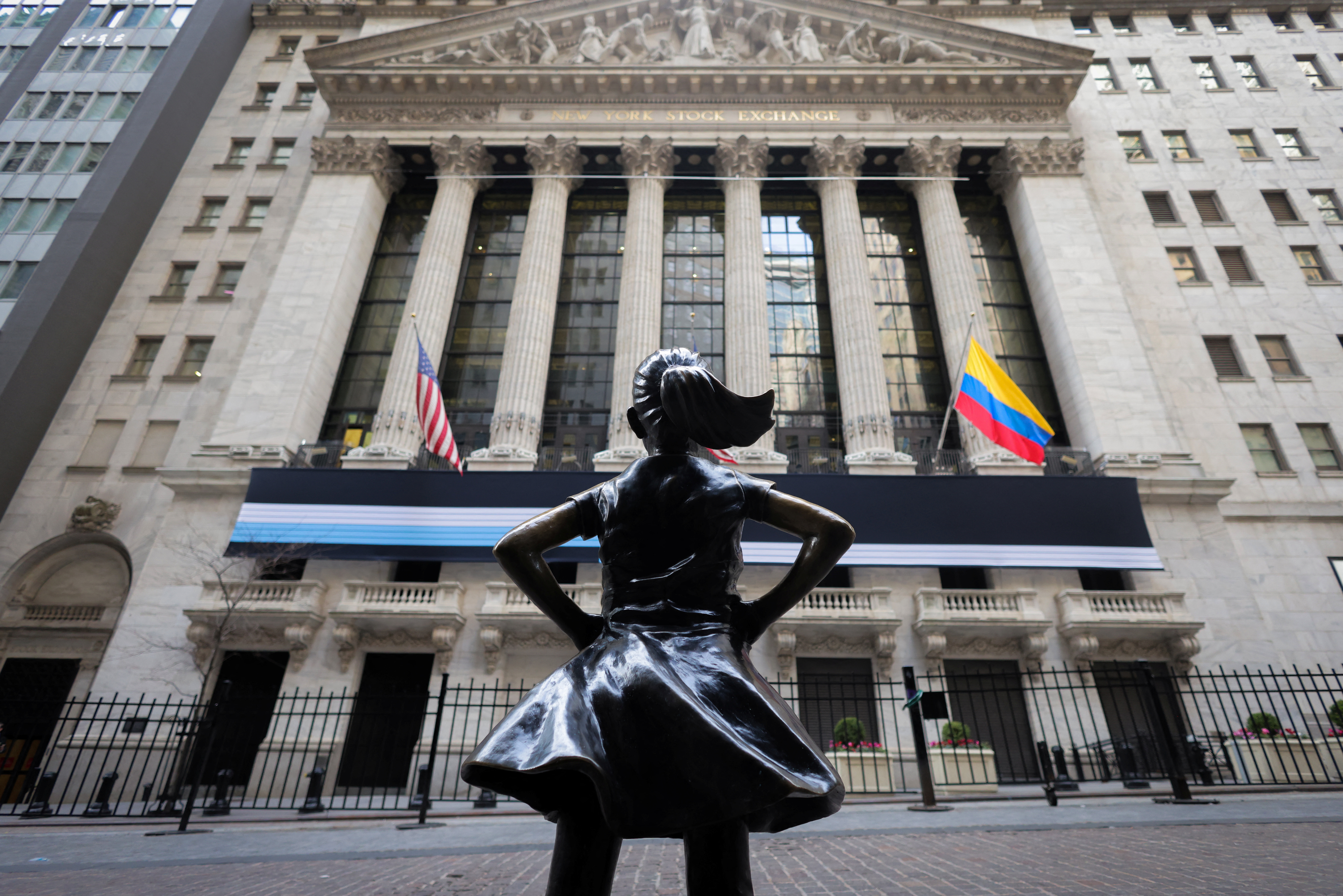 Fearless Girl Statue by artist Kristen Visbal outside of the New York Stock Exchange (NYSE) in Manhattan, New York City