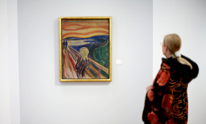 A visitor looks Edvard Munchs painting "The scream" at the Munch Museum in Oslo