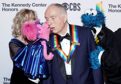 Sesame Street co-creator Lloyd Morrisett receives a kiss from Abby Cadabby as the Cookie Monster watches upon his arrival for the 42nd Annual Kennedy Awards Honors in Washington, U.S., December 8, 2019. Photo by Joshua Roberts/REUTERS