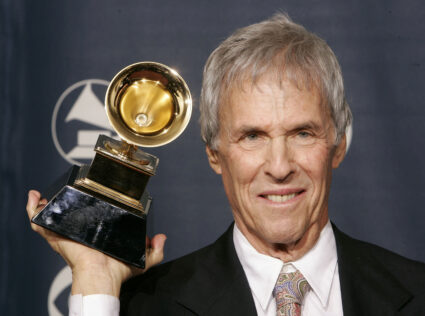 FILE PHOTO: Composer Burt Bacharach poses with the Grammy award he won for best pop instrumental album for 'At T..