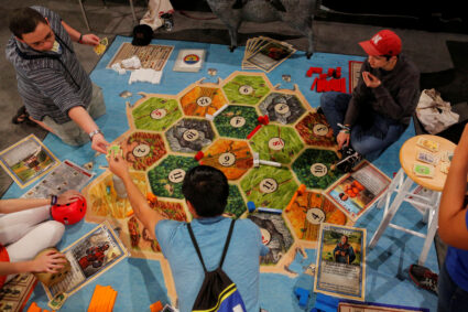 Attendees play the Catan board game at the Gaming Expo at the South by Southwest Music Film Interactive Festival 2017 in A...