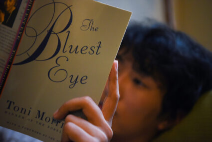 A student reads ahead of a banned book club meeting in Sugar Land