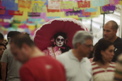 A woman with her face painted as a skull attends the start of the "Las Catrinas" festival, ahead of the Day of the Dead in Cupula on the outskirts of Morelia , October 26, 2014. La Catrina is a popular figure in Mexico known as "The Elegant Skull". The annual Day of the Dead is observed on November 1 and 2. Photo by Alan Ortega/REUTERS