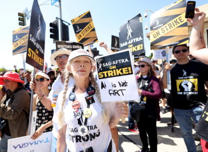 SAG-AFTRA actors and Writers Guild of America (WGA) writers walk the picket line during their ongoing strike outside Param...