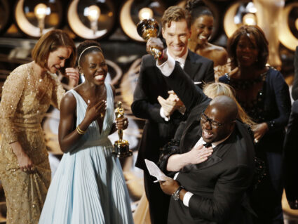 Director and producer Steve McQueen celebrates after accepting the Oscar for best picture for his film "12 Years a Slave",...