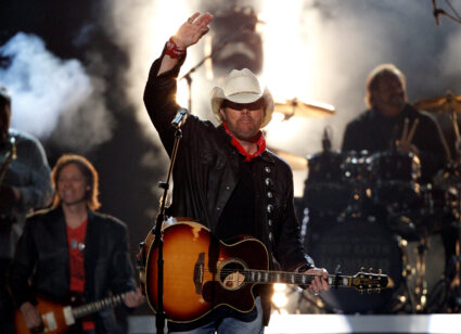 FILE PHOTO: Toby Keith waves after performing "Shut Up and Hold On" at the 49th Annual Academy of Country Music Awards in ...