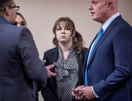 Hannah Gutierrez-Reed (center) talks with her attorney Jason Bowles (right) and her defense team during the trial against her in First District Court, in Santa Fe, N.M. on Friday, March, 1, 2024. Gutierrez-Reed, who was working as the armorer on the movie "Rust" when cinematographer Halyna Hutchins was killed by a misfire, is charged with involuntary manslaughter and tampering with evidence. Photo by Jim Weber/Pool via REUTERS